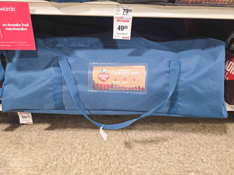 canopy cot for pets in a bag on a shelf