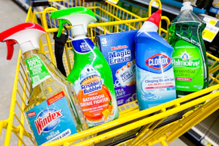 mr. clean, clorox, palmolive, scrubbing bubbles, windex in a yellow dollar general shopping cart