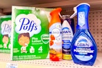 puffs tissues, febreze air freshener, dawn powersuds, and dawn powerwash dish spray on a shelf