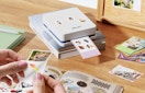 a photo printer printing photos on a table