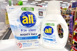 all mighty pacs and liquid detergent on a shelf