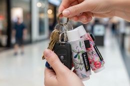 a woman holding a keyring