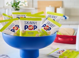 small bags of SkinnyPop Popcorn in a blue bowl 