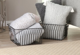 stock photo of modrn wire baskets staged in living room