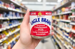 hand holding a can of eagle brand condensed milk