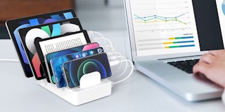 A charging station next to a computer