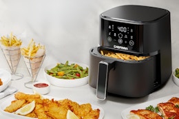 an air fryer on a counter with food