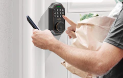 a person using a keyless entry door lock