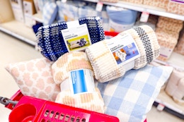 Get Plush Throw Blankets and Pillows for $7 or Less at Target card image