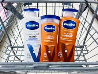 three bottles of vaseline lotion inside cart