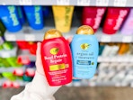 OGX Shampoo & Conditioner held up in hair care aisle in Walmart store