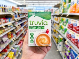hand holding truvia sweetener in walgreens