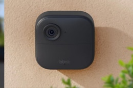 Blink Outdoor camera mounted on a wall.