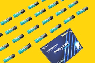 A number of single AAA batteries are arranged in straight lines above the battery box.
