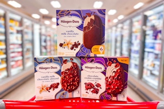 3 haagen-dazs ice cream bar boxes sitting on top of a target cart