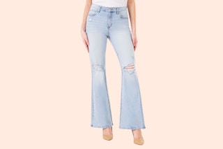 Stock image (close up shot) of woman wearing a pair of Jordache flared jeans (ripped at the knee)