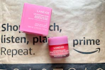 a pink jar and box on an Amazon package