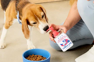 Native pet product being put into dog bowl