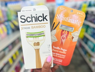 hand holding one Schick Xtreme Bamboo and Skintimate razor