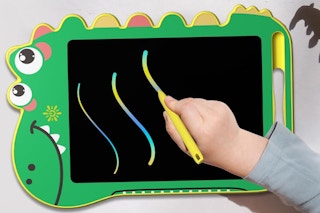 child writing on dinosaur LCD writing tablet