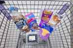 protein bread, snack bags, 67 chicken nuggets, sliced cheese, and blueberries in a cart