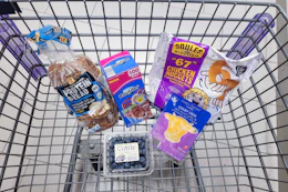 protein bread, snack bags, 67 chicken nuggets, sliced cheese, and blueberries in a cart