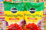 2 miracle-gro potting mix bags on top of a target cart