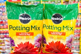 2 miracle-gro potting mix bags on top of a target cart