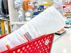 room essentials body pillow sitting in a target cart