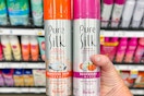 hand holding two cans of pure silk shaving cream 