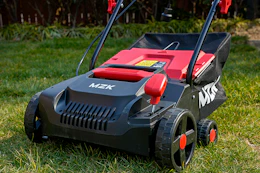 an electric dethatcher on a lawn