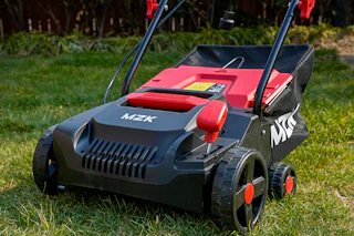 an electric dethatcher on a lawn