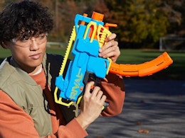 a person holding a Nerf blasters
