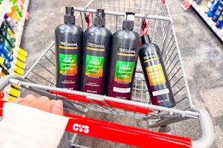 4 bottles of tresemme shampoo and conditioner in a cart