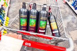 4 bottles of tresemme shampoo and conditioner in a cart