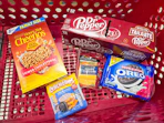 dr pepper, cheerios, lunchables, sargento cheese, and oreos in a cart