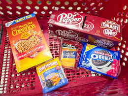dr pepper, cheerios, lunchables, sargento cheese, and oreos in a cart