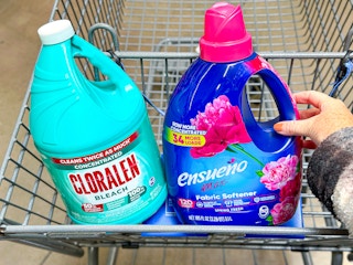 hand holding ensueno bottle in walmart cart next to cloralen bottle