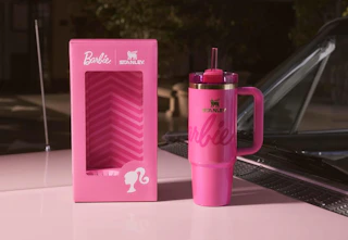 a pink Barbie-themed Stanley on a pink car