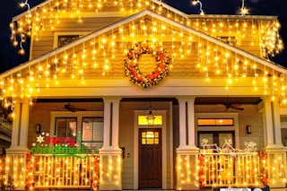 icicle lights hanging on front of house