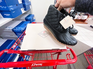 boots being held by shoe box on jcpenney cart