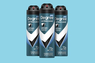 three cans of deodorant spray
