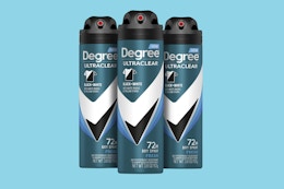 three cans of deodorant spray