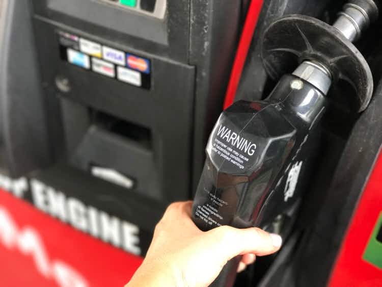Hand holding a gas pump