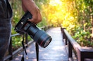 someone using a camera to take photos outdoors