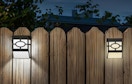 solar lights on a wooden fence