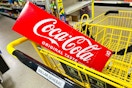coca-cola 12-pack in a shopping cart