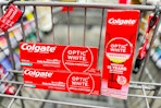 3 colgate toothpastes in a cart