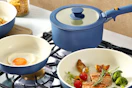 Lifestyle image of the Carote Cookware Set in the color Navy Blue