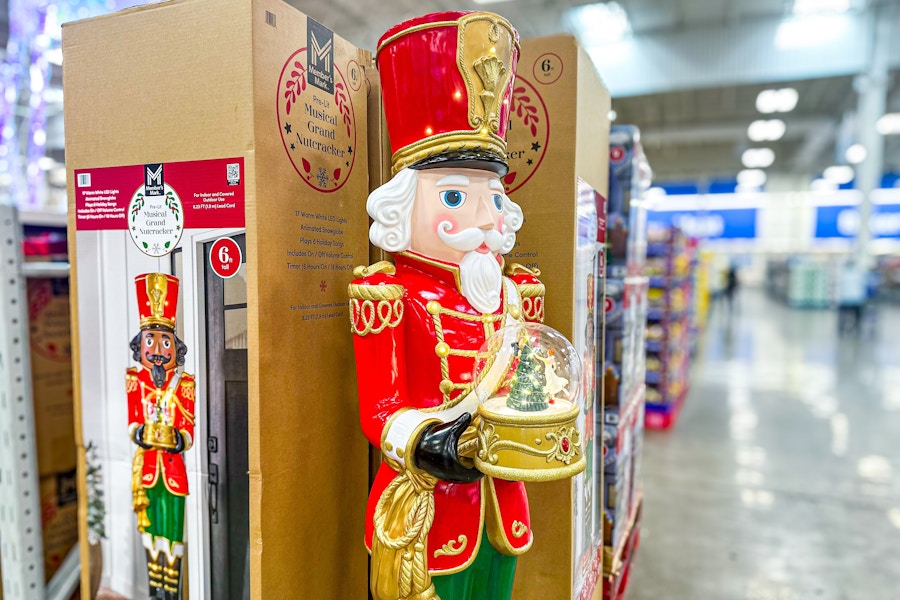 6' nutcracker holding a snowglobe